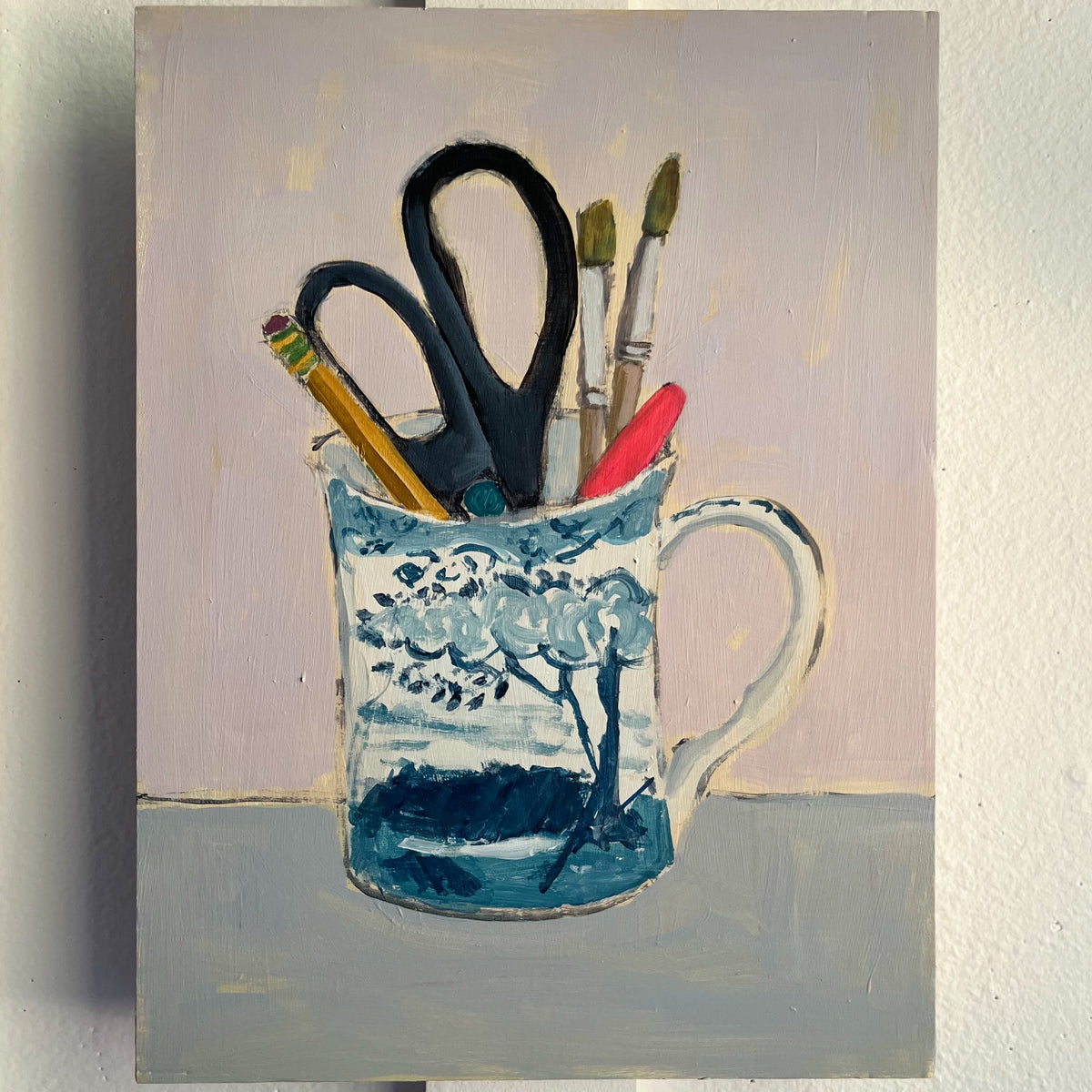 Fancy Cup and Pens — scissors, pens, and brushes in a blue-and-white patterned mug. Painting by Maggie Stickney.