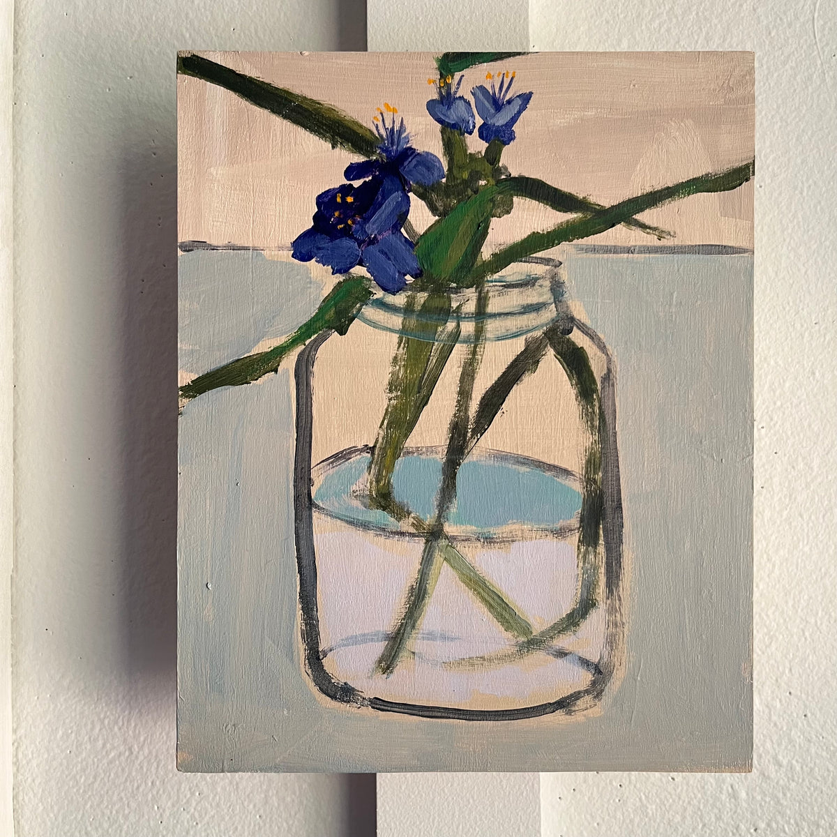 Spiderwort — small blue-purple spiderwort flowers on long green stems in a clear jar. Painting by Maggie Stickney.