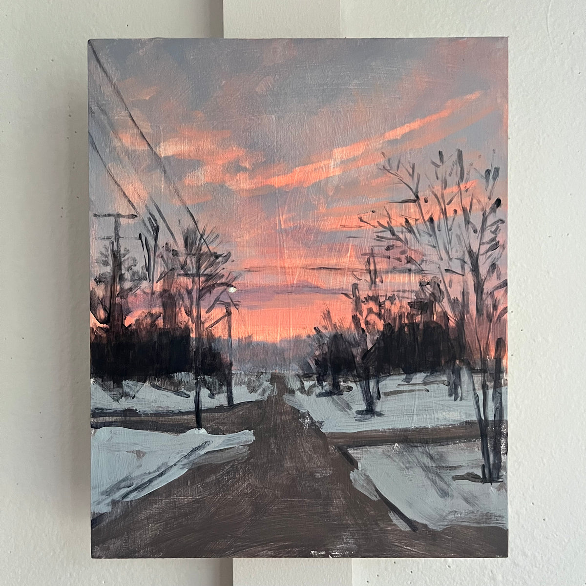 Winter Sunset no 12 — a snowy road between bare trees beneath pink sunset clouds. Painting by Maggie Stickney.