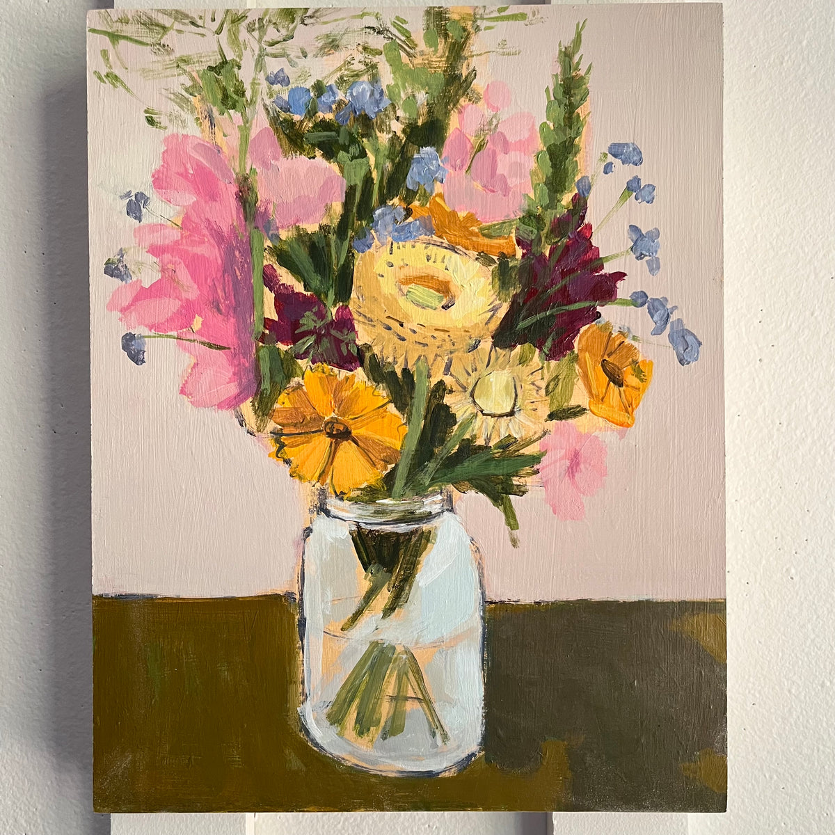 Jam Jar Bouquet no 4 — pink, yellow, and white flowers in a jam jar on a dark tabletop. Painting by Maggie Stickney.