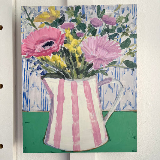 Bouquet in Striped Pitcher — pink flowers in a pink-and-white striped pitcher on a green tabletop. Painting by Maggie Stickney.