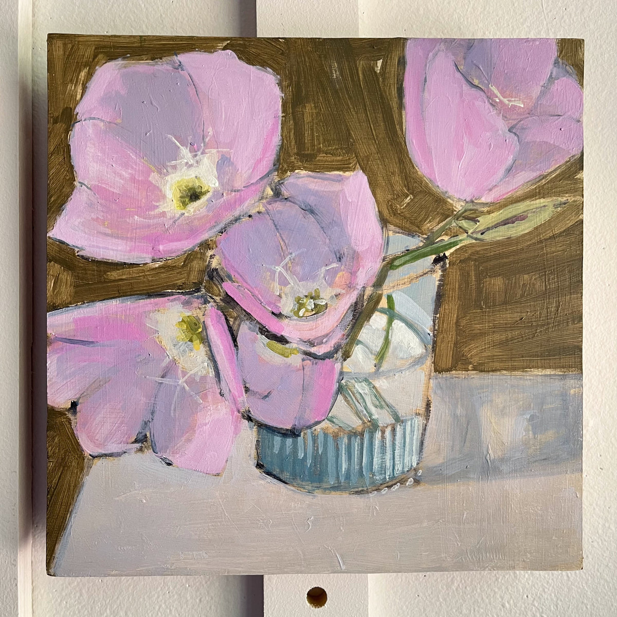 Evening Primrose — pale pink and lavender primrose flowers in a small glass vase. Painting by Maggie Stickney.